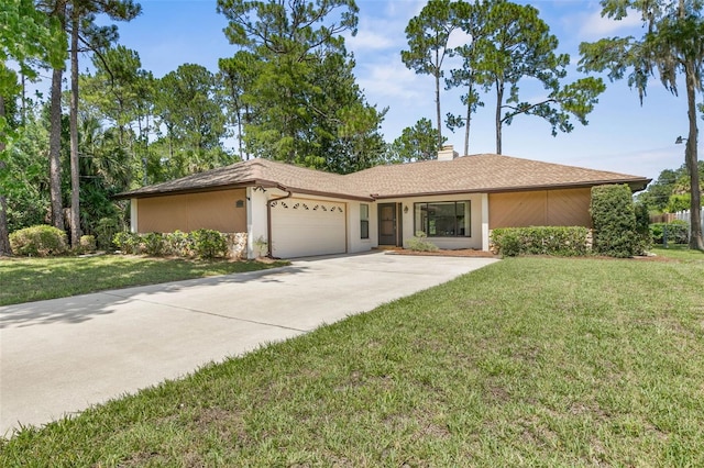 ranch-style house featuring a garage and a front yard