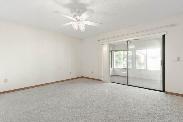 unfurnished room with carpet, a textured ceiling, and ceiling fan