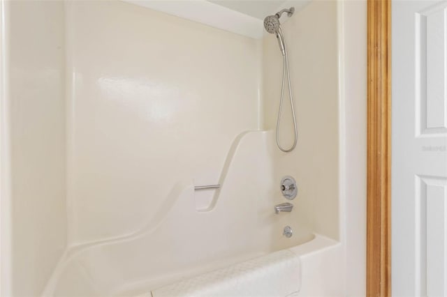 bathroom featuring washtub / shower combination