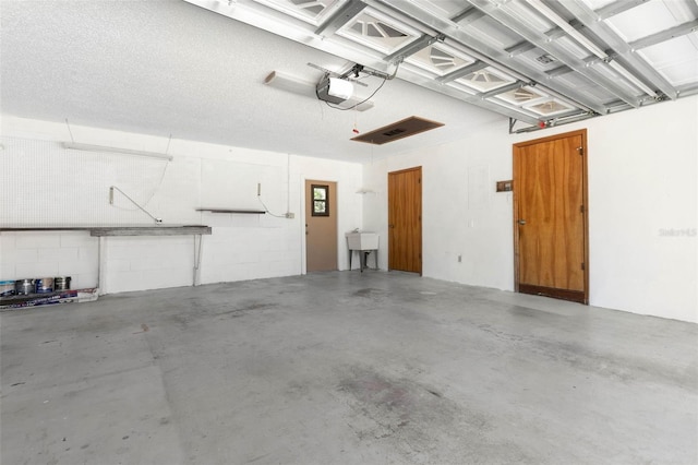 garage with sink and a garage door opener