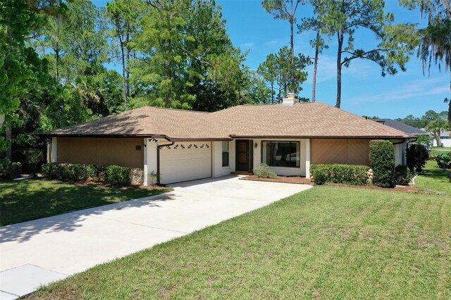 single story home with a garage and a front yard