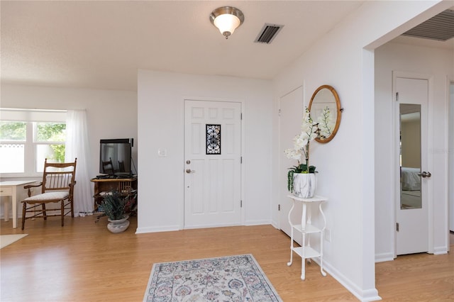 foyer with light wood-type flooring