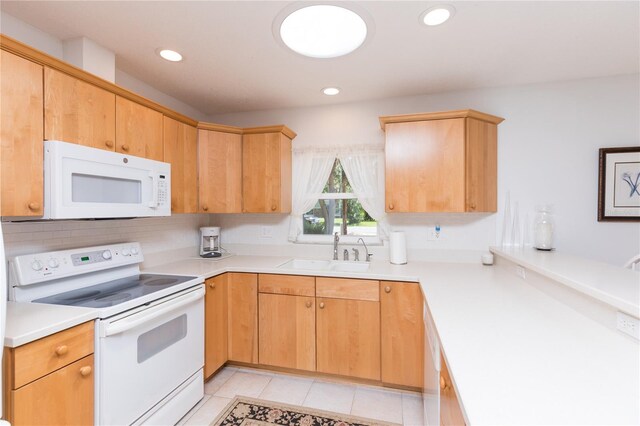 kitchen with light tile patterned flooring, sink, white appliances, and backsplash