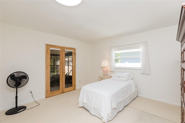 bedroom with access to outside and french doors