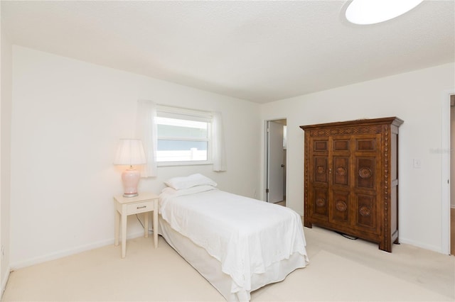 bedroom with light colored carpet