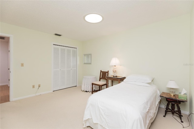 carpeted bedroom featuring a closet