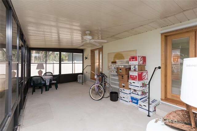 sunroom featuring ceiling fan