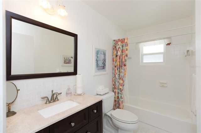 full bathroom featuring vanity, decorative backsplash, toilet, and shower / bath combination with curtain