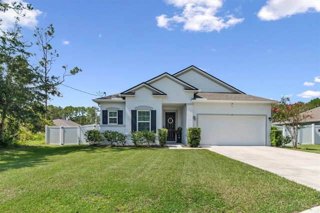 view of front of property featuring a garage and a front lawn