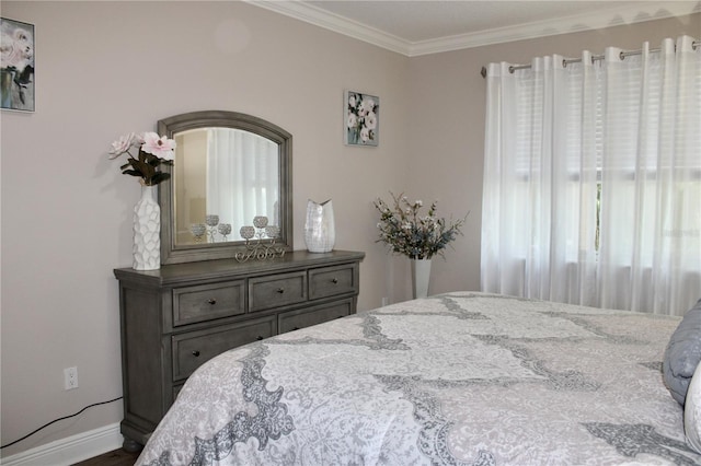 bedroom featuring crown molding