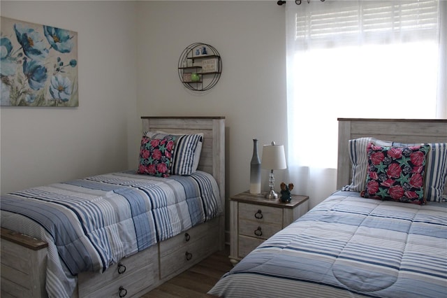 bedroom with hardwood / wood-style floors