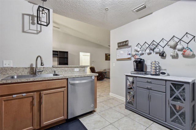 kitchen with a sink, brown cabinetry, stainless steel dishwasher, and light countertops