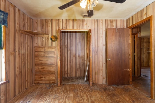 spare room featuring hardwood / wood-style floors and ceiling fan