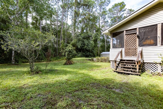 view of yard featuring a sunroom