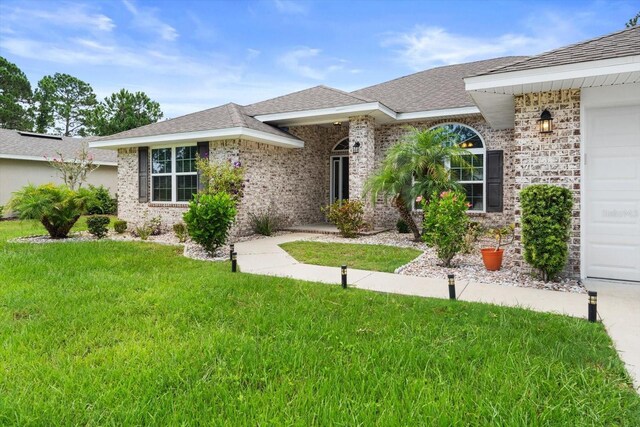 single story home with a front yard