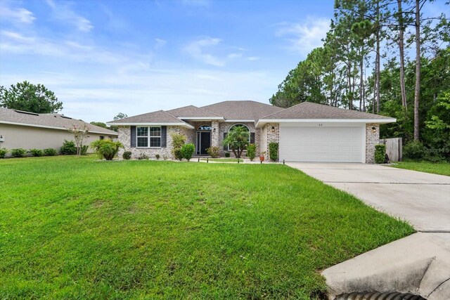 single story home with a garage and a front yard