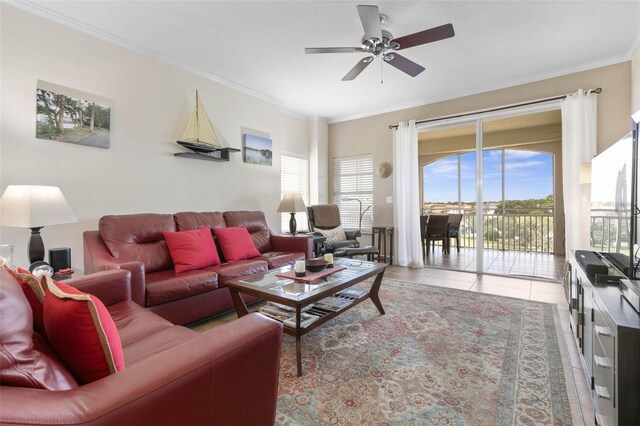 tiled living room with crown molding and ceiling fan