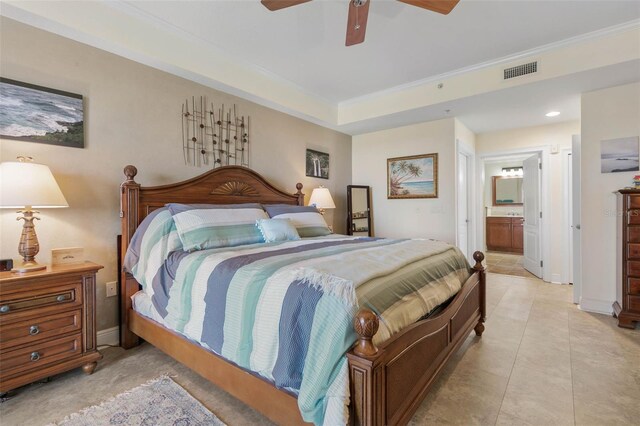 bedroom with ceiling fan, crown molding, connected bathroom, and light tile patterned floors