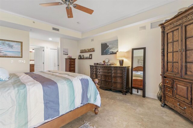 tiled bedroom featuring ceiling fan, ensuite bath, and ornamental molding