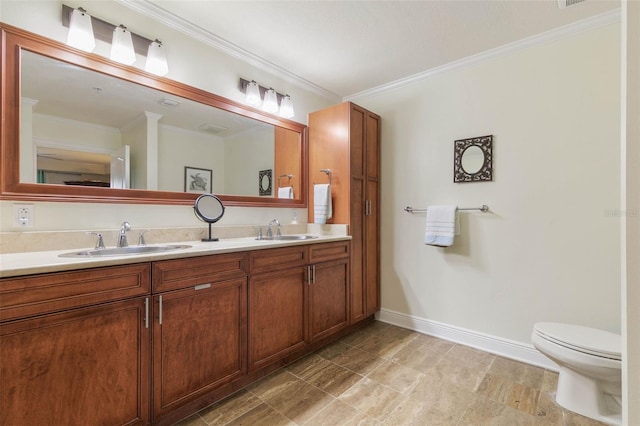 bathroom featuring dual bowl vanity, toilet, ornamental molding, and tile patterned flooring