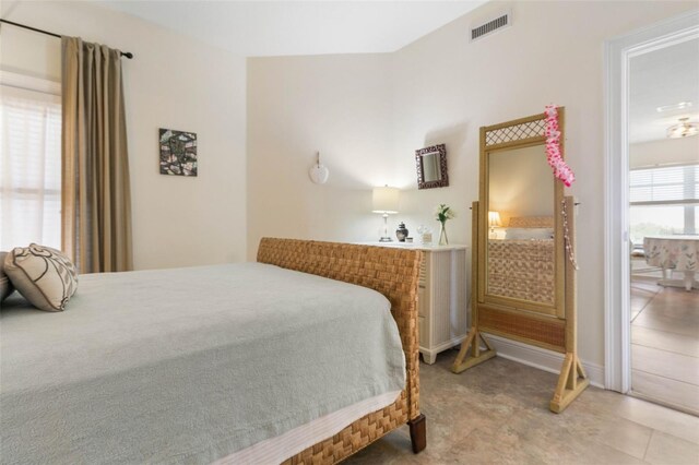 bedroom featuring light tile patterned floors