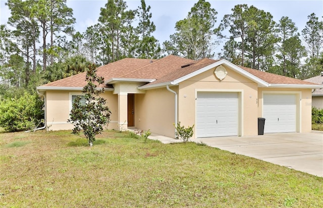 view of front of home with a garage and a front lawn