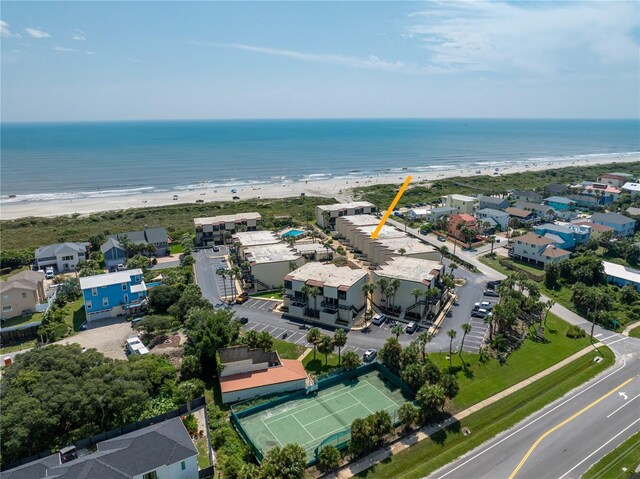 bird's eye view featuring a water view and a view of the beach