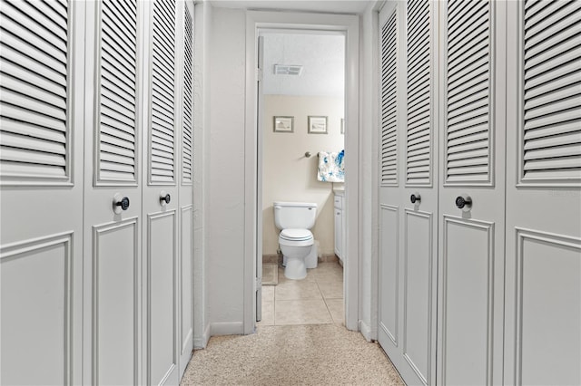 bathroom with tile patterned floors and toilet