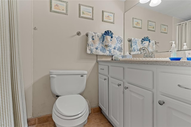 full bathroom featuring tile patterned flooring, vanity, and toilet