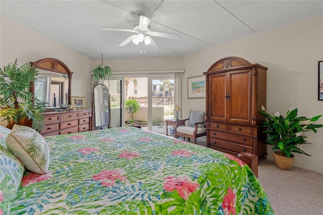 bedroom featuring access to outside, ceiling fan, carpet, and a textured ceiling