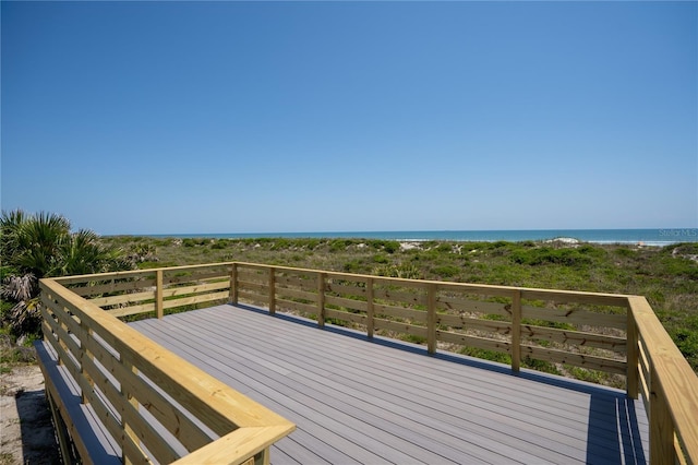 wooden deck featuring a water view