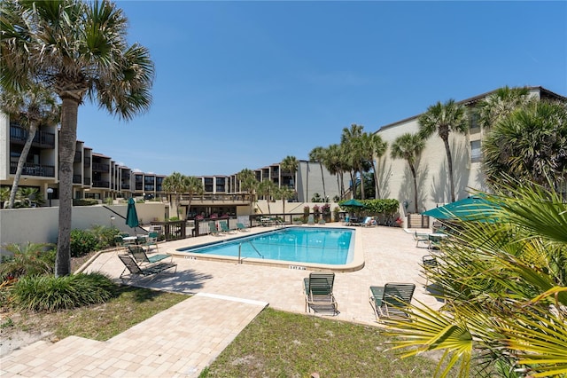 view of pool featuring a patio