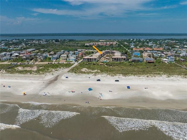 aerial view with a water view, a residential view, and a view of the beach