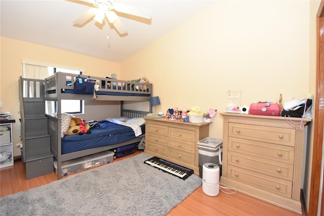 bedroom featuring lofted ceiling, hardwood / wood-style floors, and ceiling fan