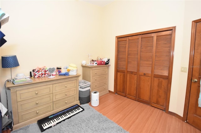 bedroom featuring a closet and light hardwood / wood-style floors