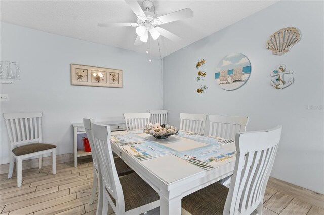 dining room featuring wood finish floors and ceiling fan