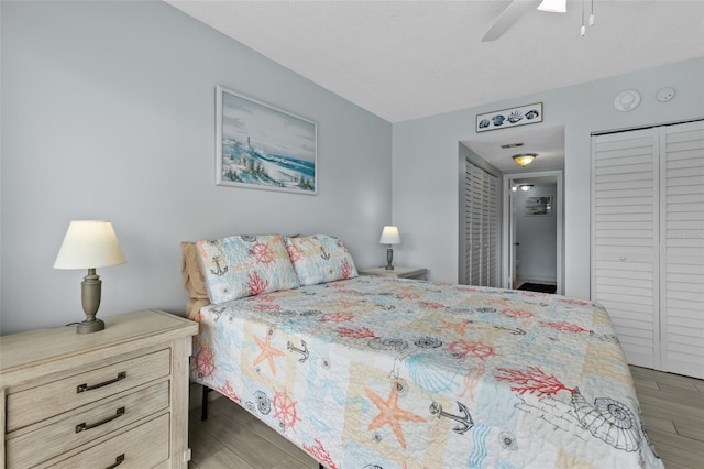 bedroom featuring light wood-style floors and a ceiling fan