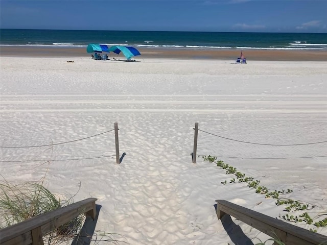 property view of water with a beach view