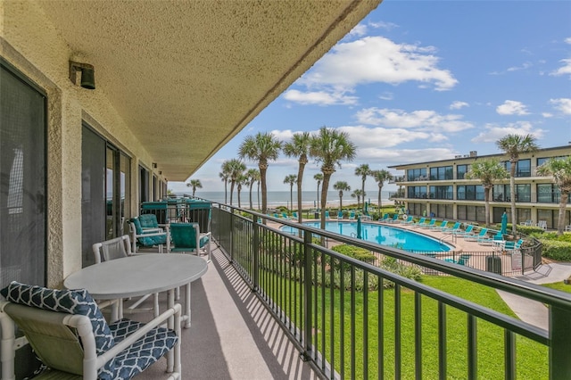 balcony featuring a water view