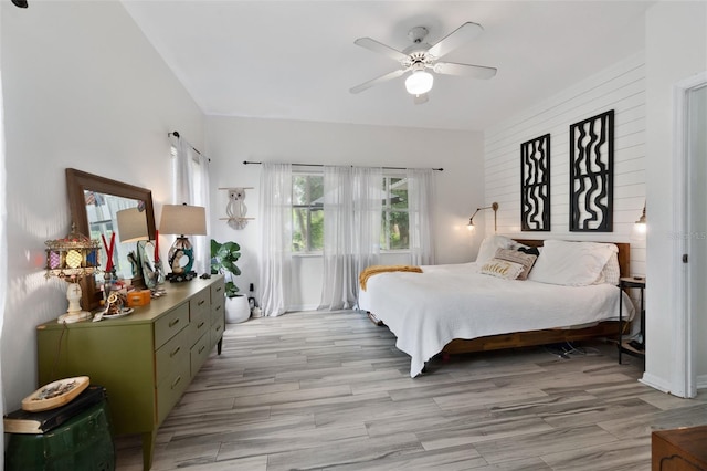 bedroom featuring a ceiling fan and light wood-style flooring