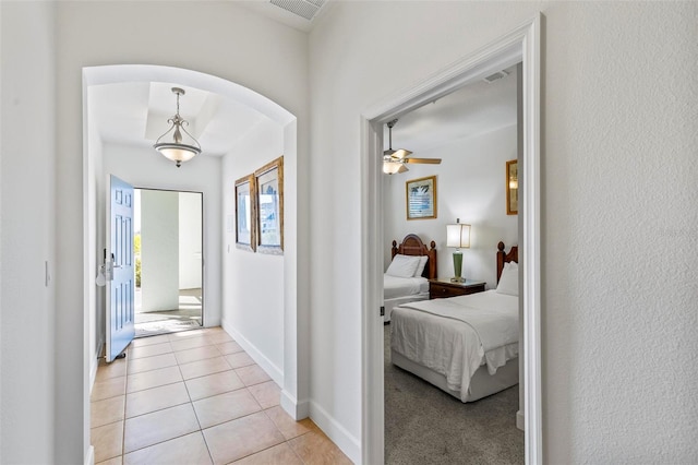 hallway with light tile patterned floors