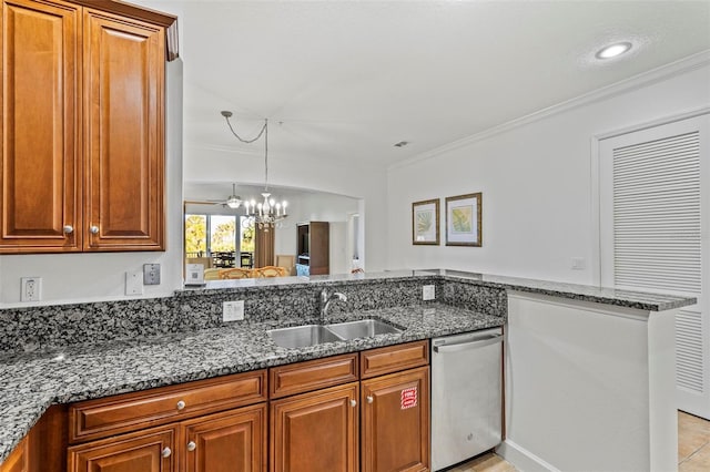 kitchen featuring dark stone counters, stainless steel dishwasher, and sink