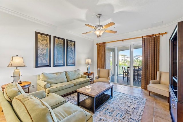 living room with ornamental molding, ceiling fan, and light tile patterned flooring