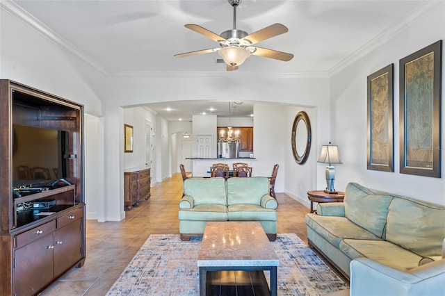 living room with ornamental molding, light tile patterned flooring, and ceiling fan with notable chandelier