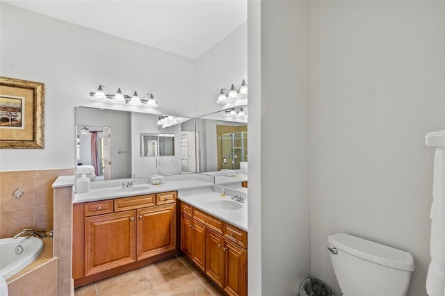 full bathroom with vanity, tile patterned floors, plus walk in shower, and toilet