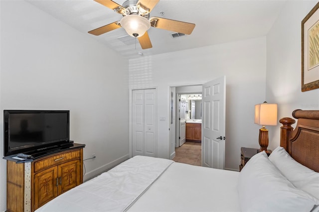 bedroom with light tile patterned flooring, ceiling fan, and a closet