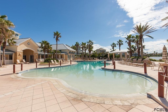 view of swimming pool with a patio area