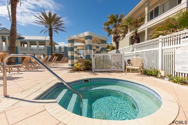 view of pool featuring a hot tub