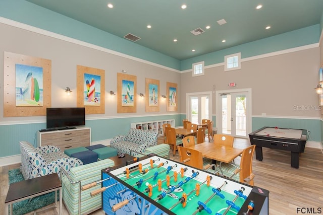 playroom featuring french doors and light hardwood / wood-style floors