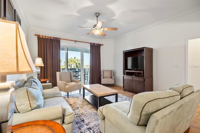 living room with ornamental molding and ceiling fan